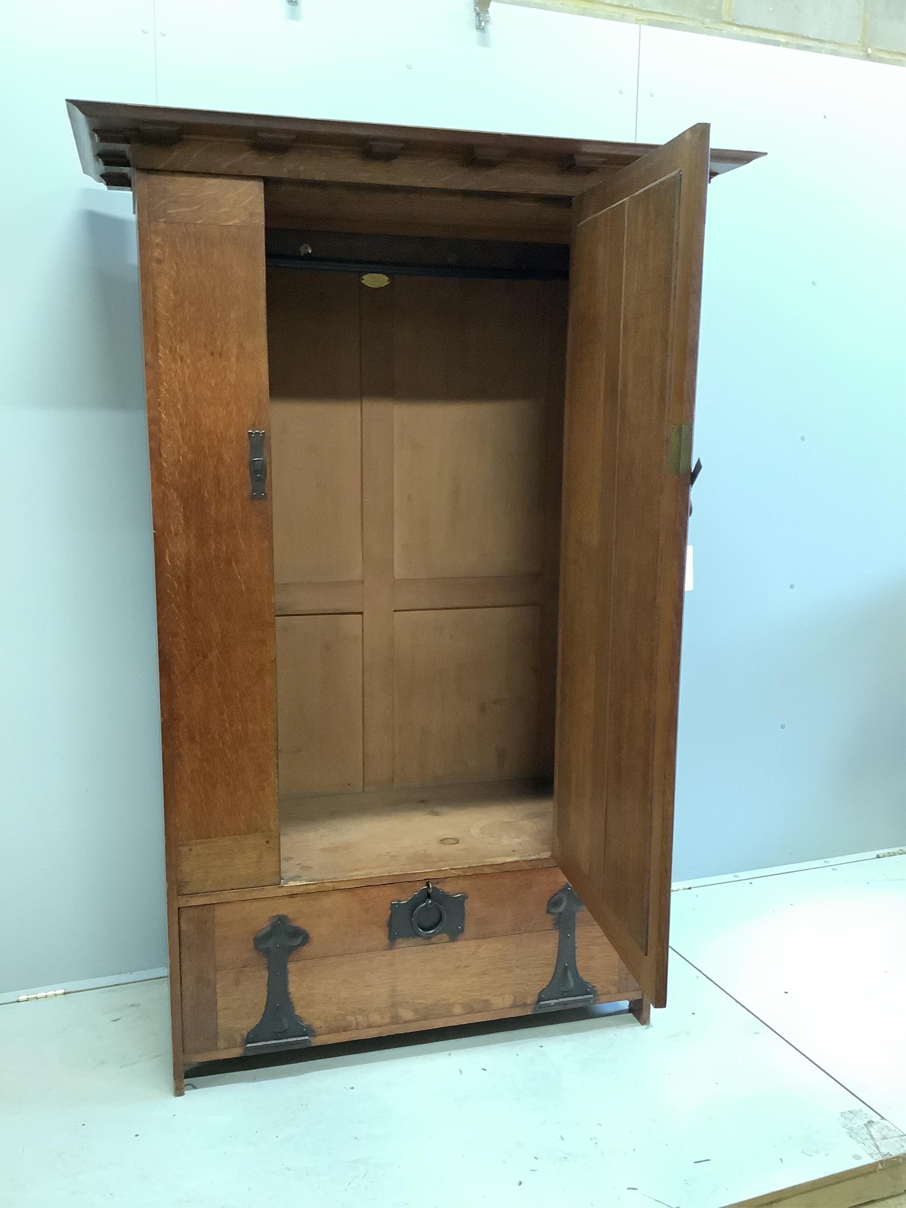 Ambrose Heal (1872-1959) for Heal & Son, London. A 'St Ives' oak wardrobe, c.1898, width 128cm, depth 61cm, height 189cm. Condition - good